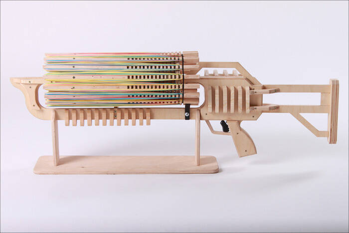Because what man wouldn't want a rubber band machine gun? 